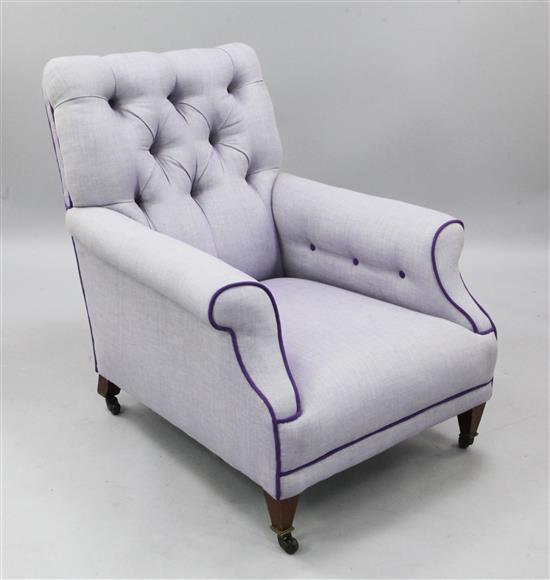 An Edwardian violet tweed upholstered button back armchair,
